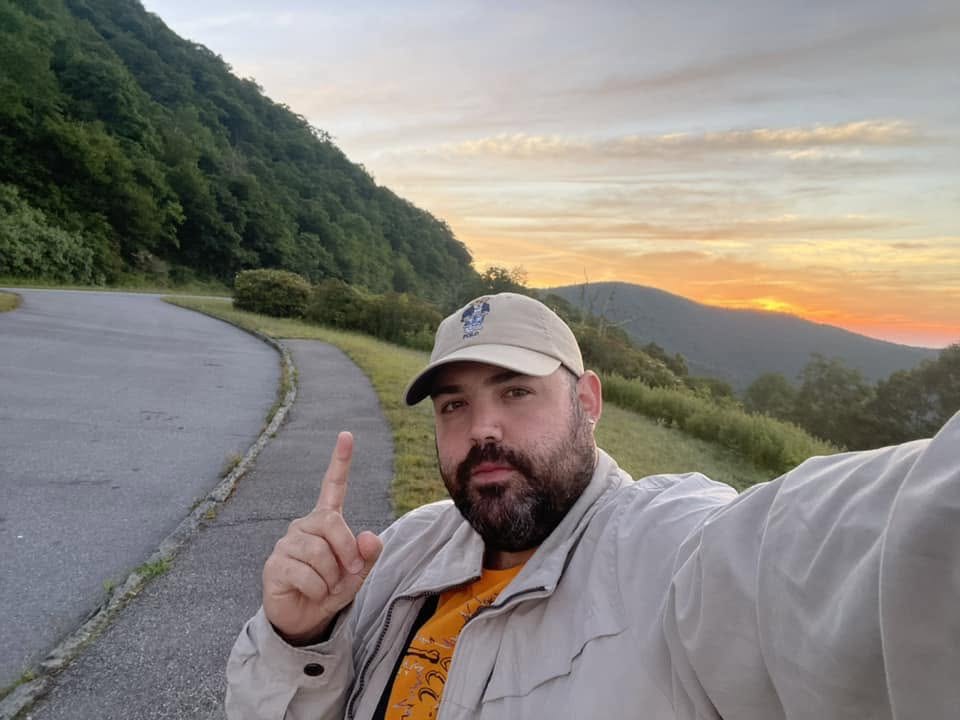 John Geremia on a mountain road at sunrise